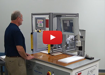 A worker operating the automatic rfid tag applicator for cabinet doors